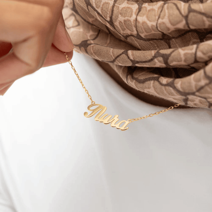 Votre nom. En véritable calligraphie arabe.